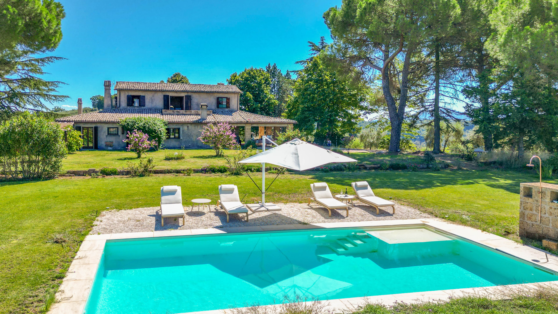 Aerial view of the farmhouse, garden and swimming pool
