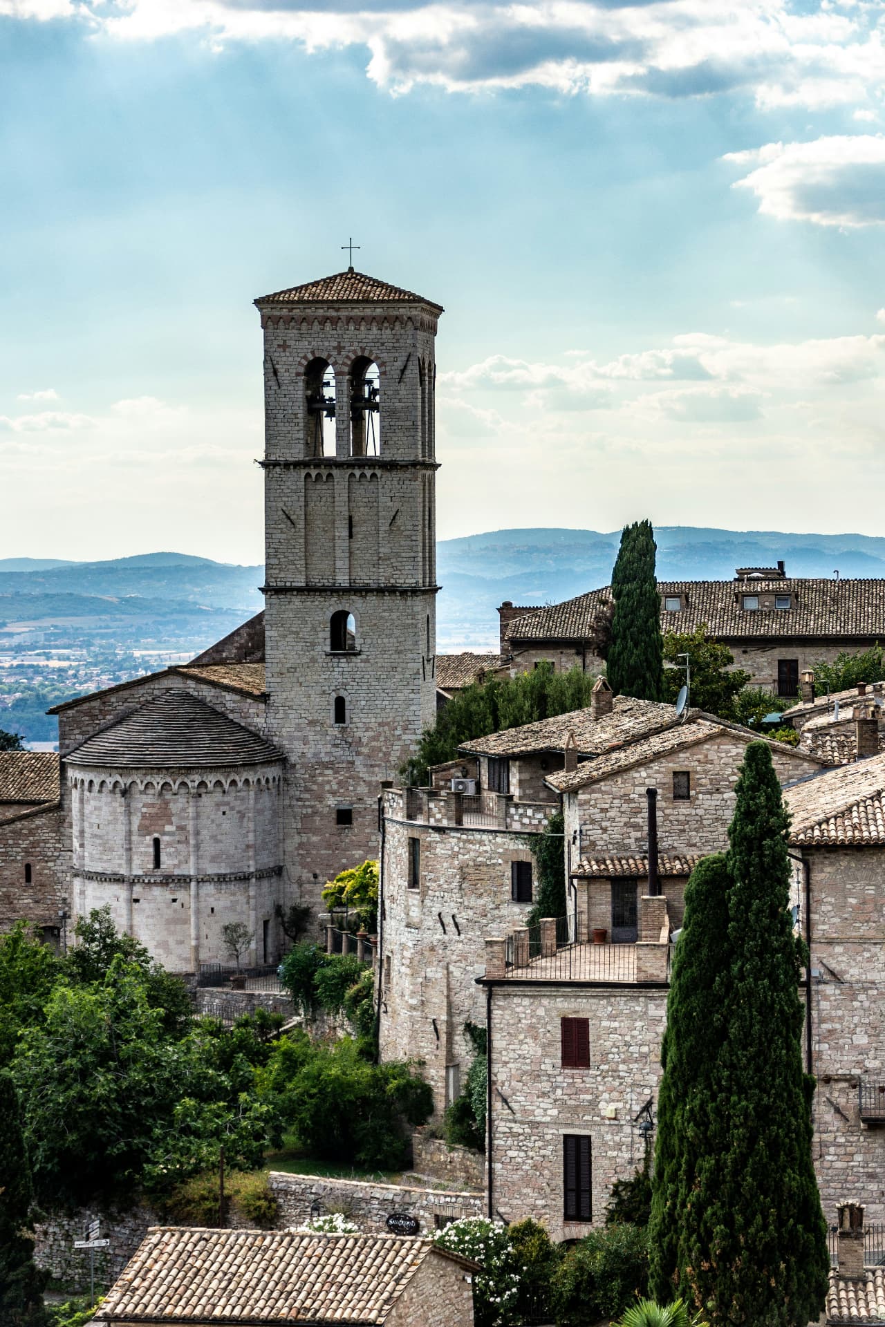 The bell tower of Santa Maria Maggiore above the Assisi rooftops