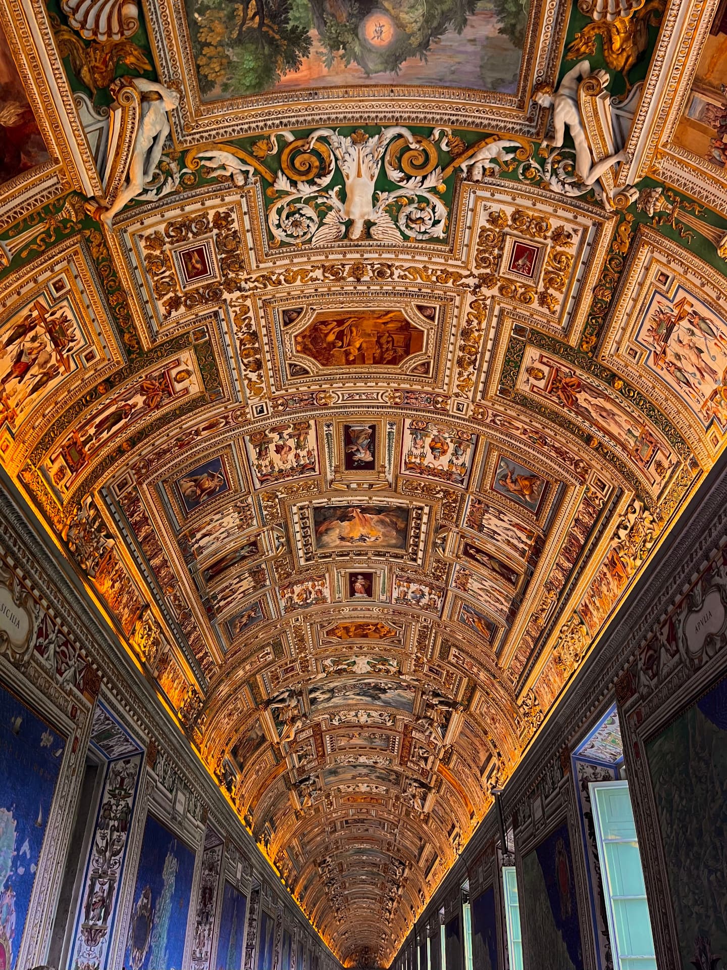 The gilded, frescoed vaults of the Gallery of Maps running into the distance