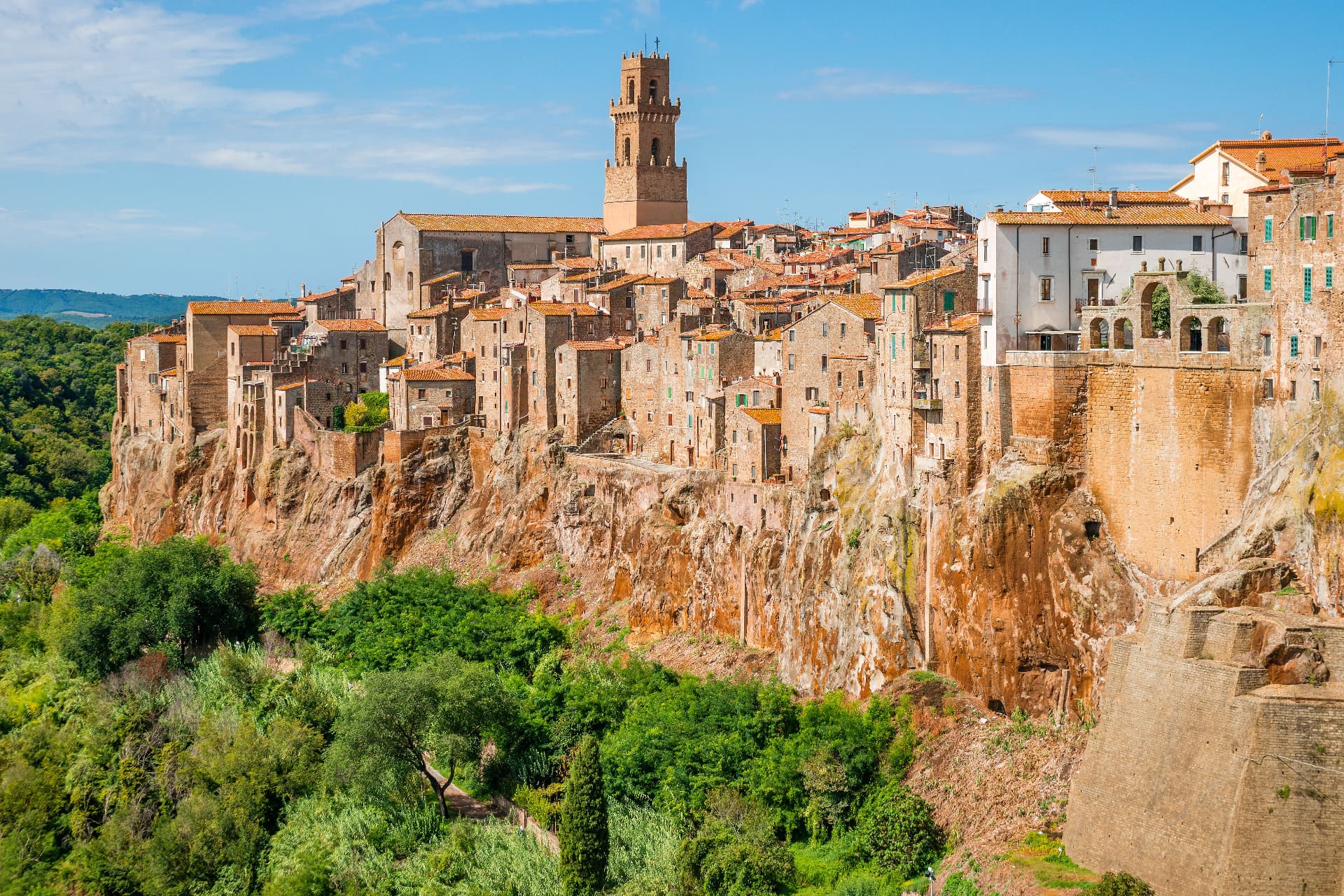 Pitigliano along its sheer tufa cliff, the cathedral bell tower above the roofs