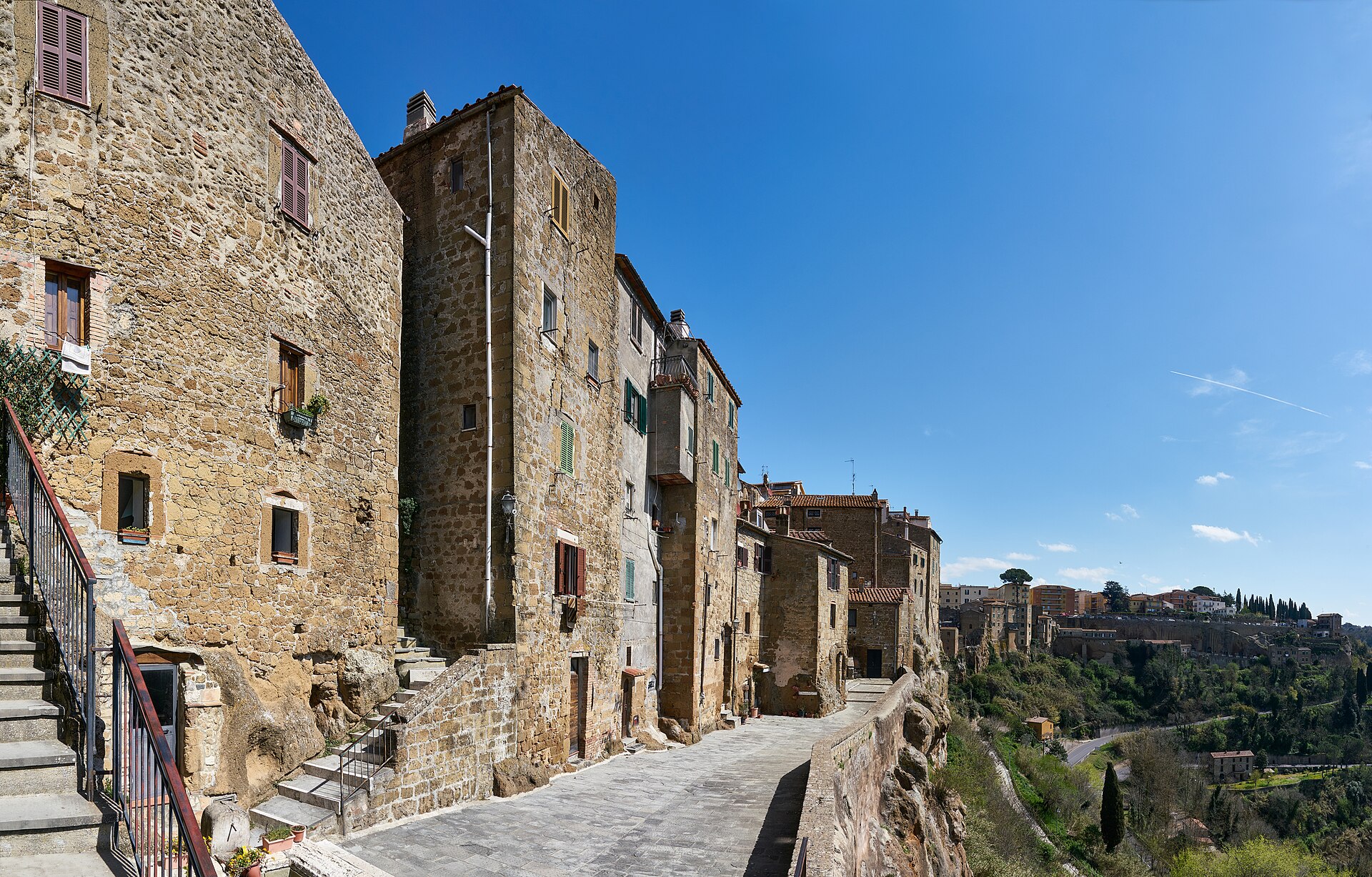 Pitigliano perched on sheer tufa cliffs at sunset